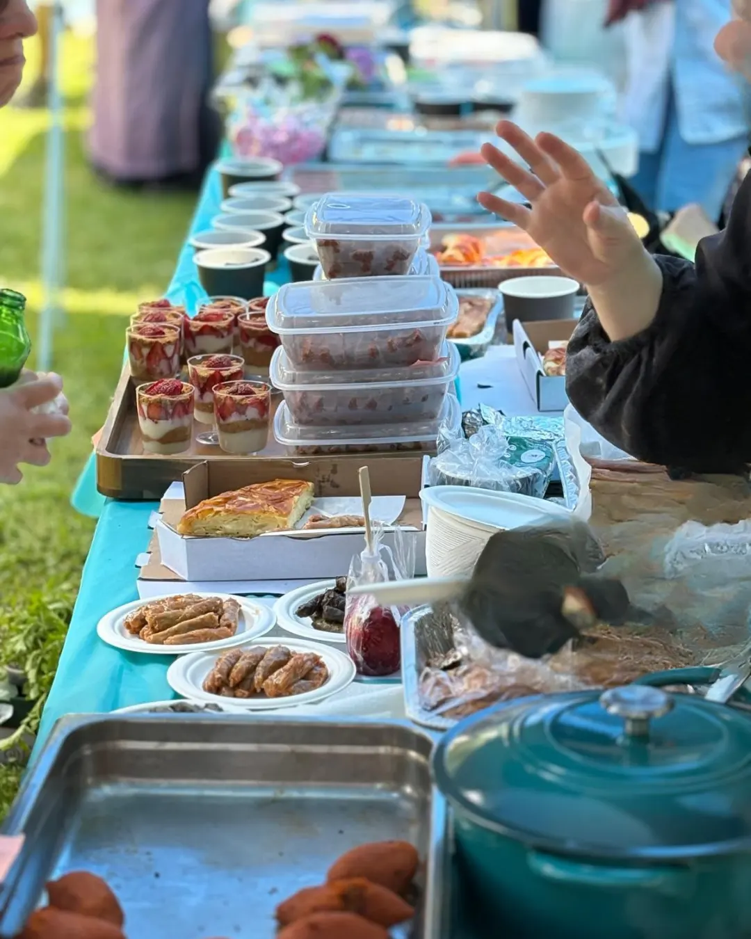 Turkish Food Festival Guests from diverse communities attending the GRFS Turkish Food Festival with children playing soccer and families enjoying Father’s Day activities.