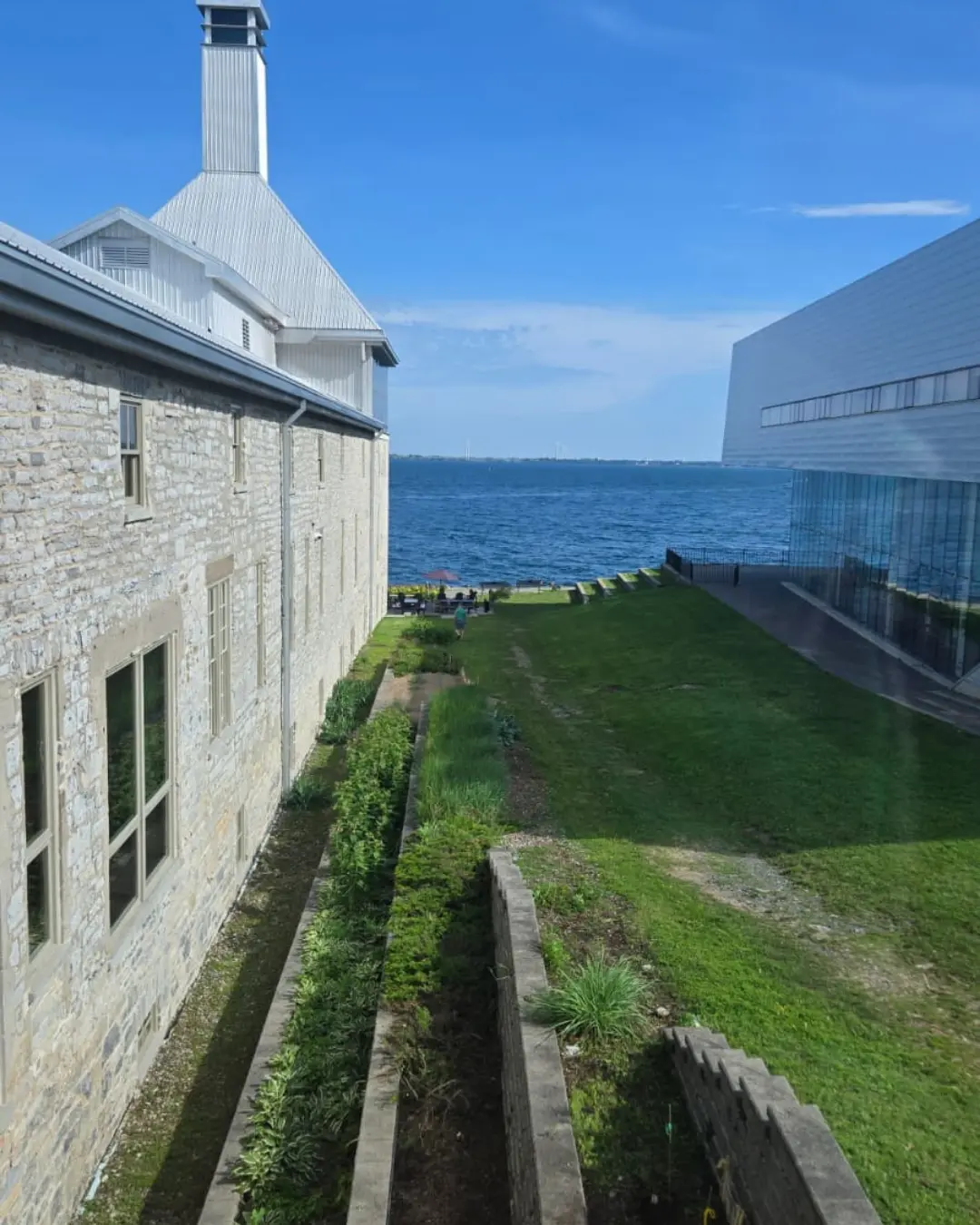 Historic limestone building and modern waterfront architecture seen during the GRFS Grade 12 Kingston trip