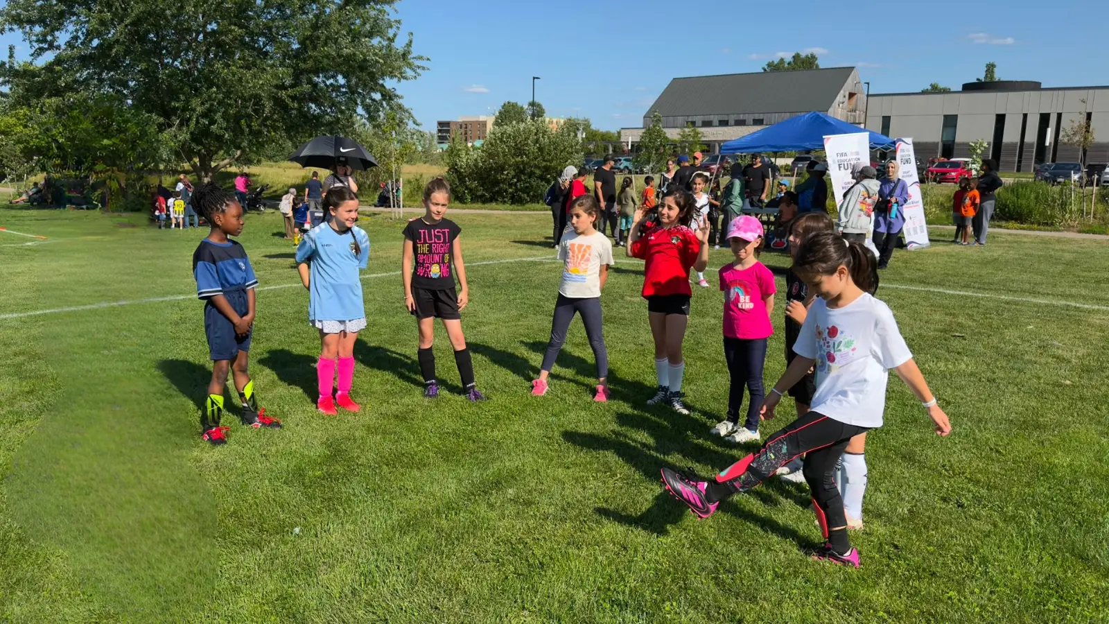 Children practising soccer skills during the GRFS Football for Learning summer program.