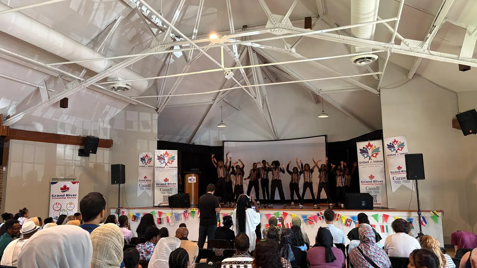 United in Voices Intercultural Dialogue Festival participants, performers, community booths, and cultural activities at Victoria Park hosted by Grand River Friendship Society.