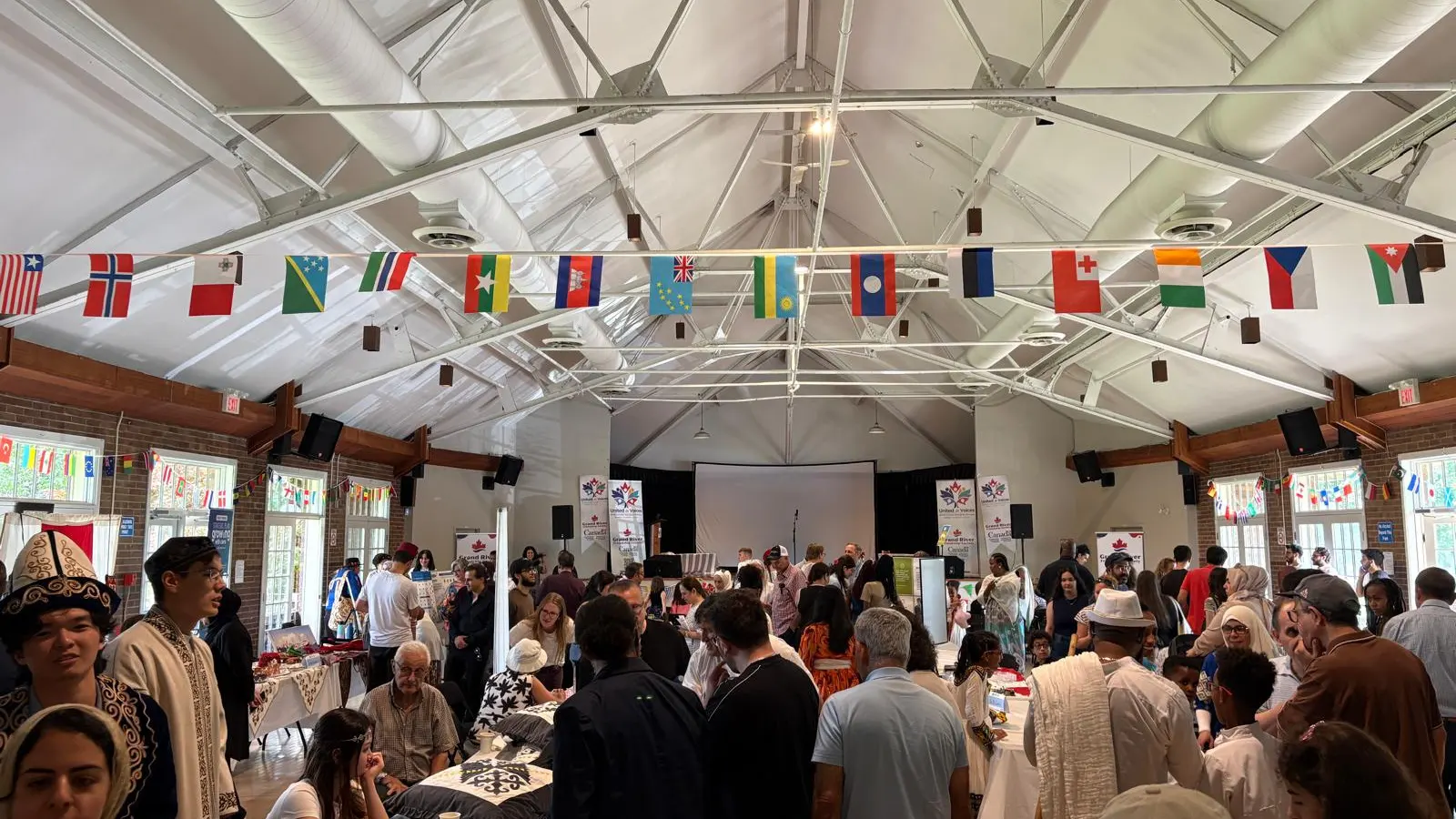 United in Voices Intercultural Dialogue Festival participants, performers, community booths, and cultural activities at Victoria Park hosted by Grand River Friendship Society.