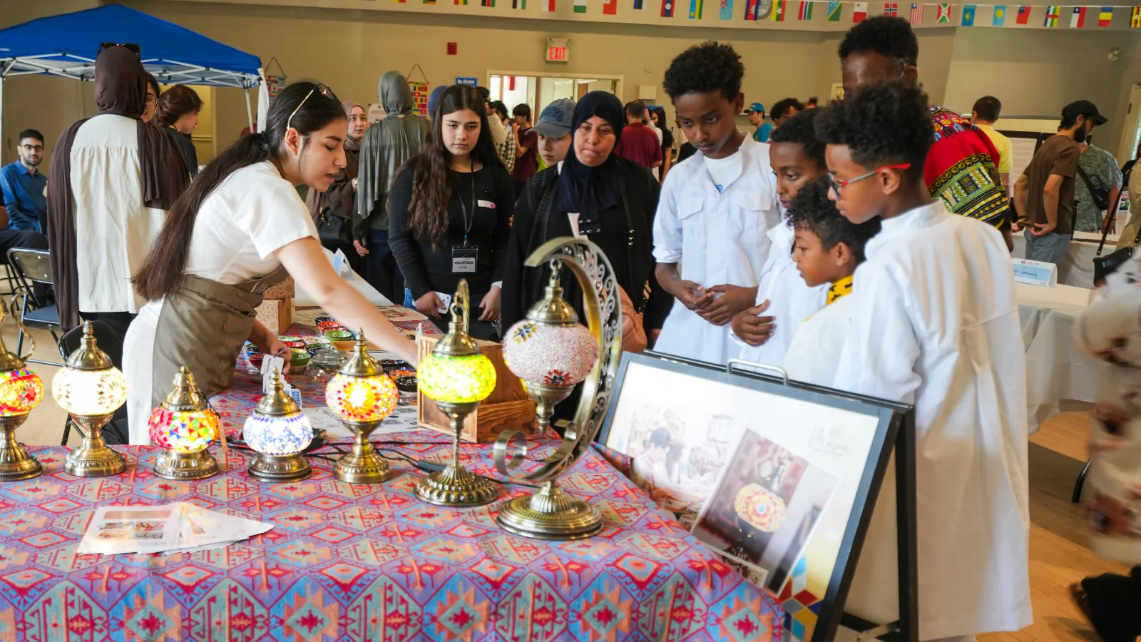 United in Voices Intercultural Dialogue Festival participants, performers, community booths, and cultural activities at Victoria Park hosted by Grand River Friendship Society.