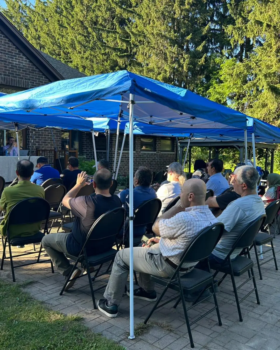 Families attending the GRFS Family Conversations #2 program in the GRFS garden, focused on communication, relationships, and stronger family connections.