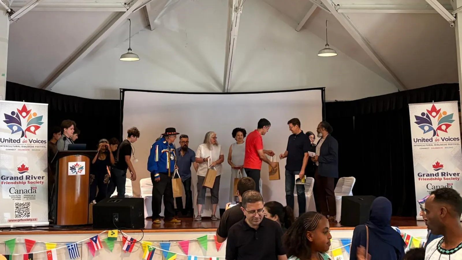 United in Voices Intercultural Dialogue Festival participants, performers, community booths, and cultural activities at Victoria Park hosted by Grand River Friendship Society.