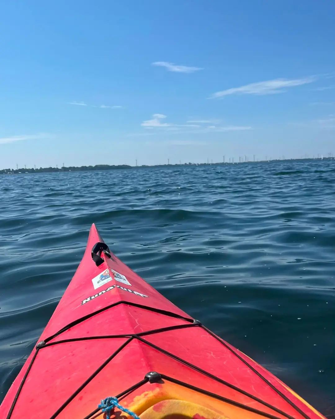 View from a red kayak across the water during the GRFS Grade 12 Kingston trip