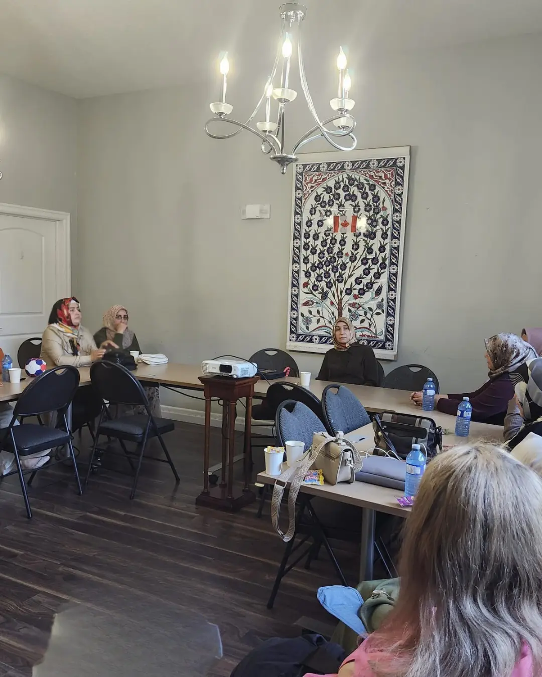 Families attending the GRFS Family Conversations #2 program in the GRFS garden, focused on communication, relationships, and stronger family connections.