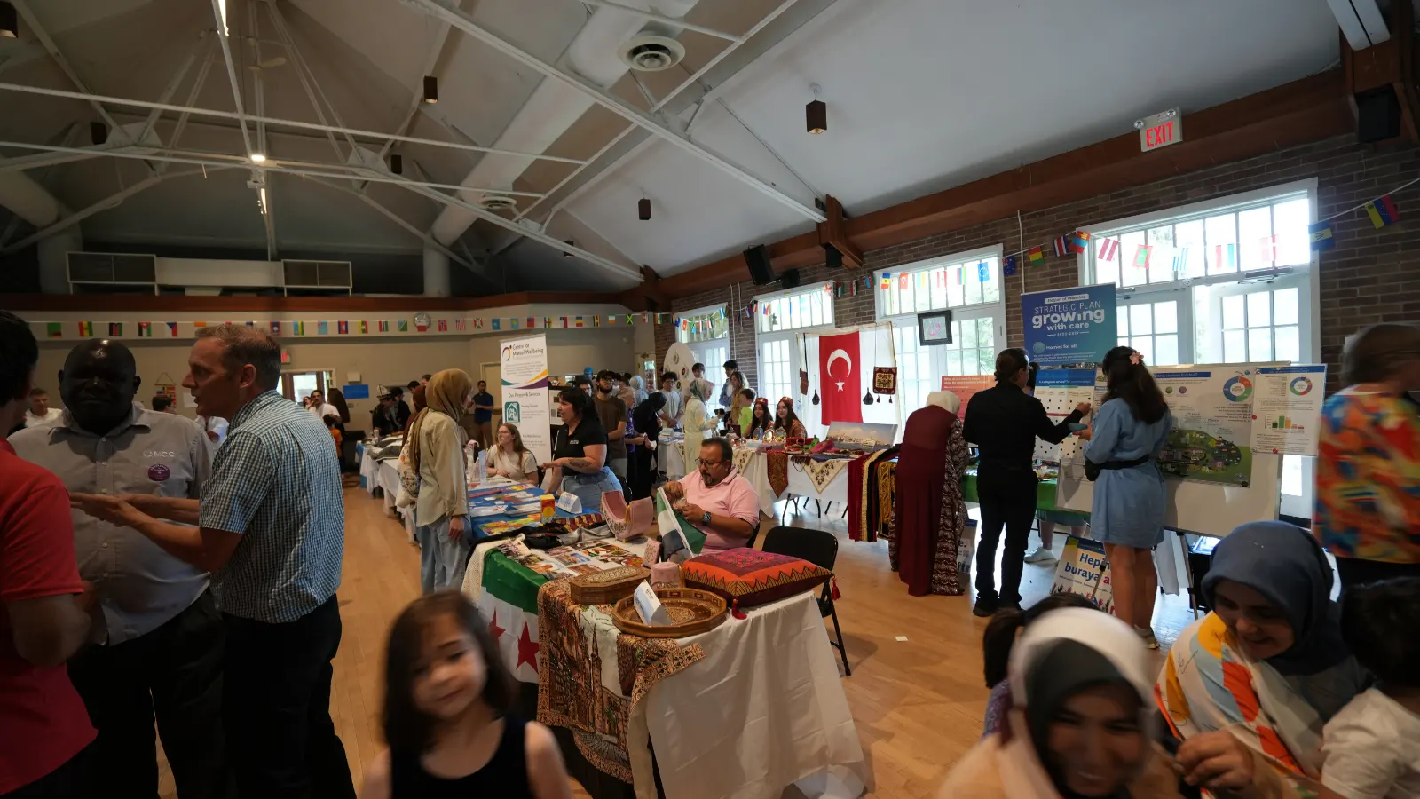 United in Voices Intercultural Dialogue Festival participants, performers, community booths, and cultural activities at Victoria Park hosted by Grand River Friendship Society.