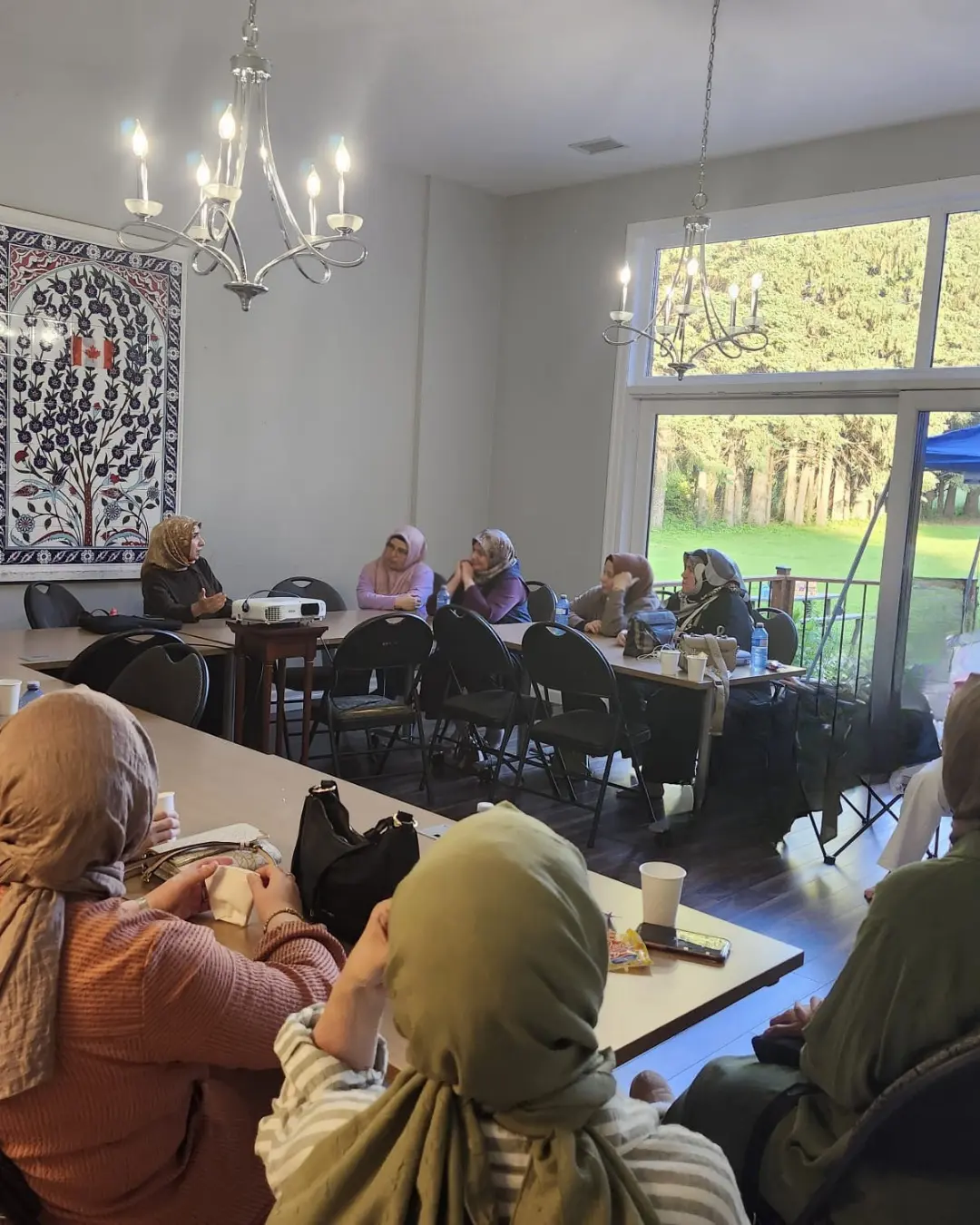 Families attending the GRFS Family Conversations #2 program in the GRFS garden, focused on communication, relationships, and stronger family connections.