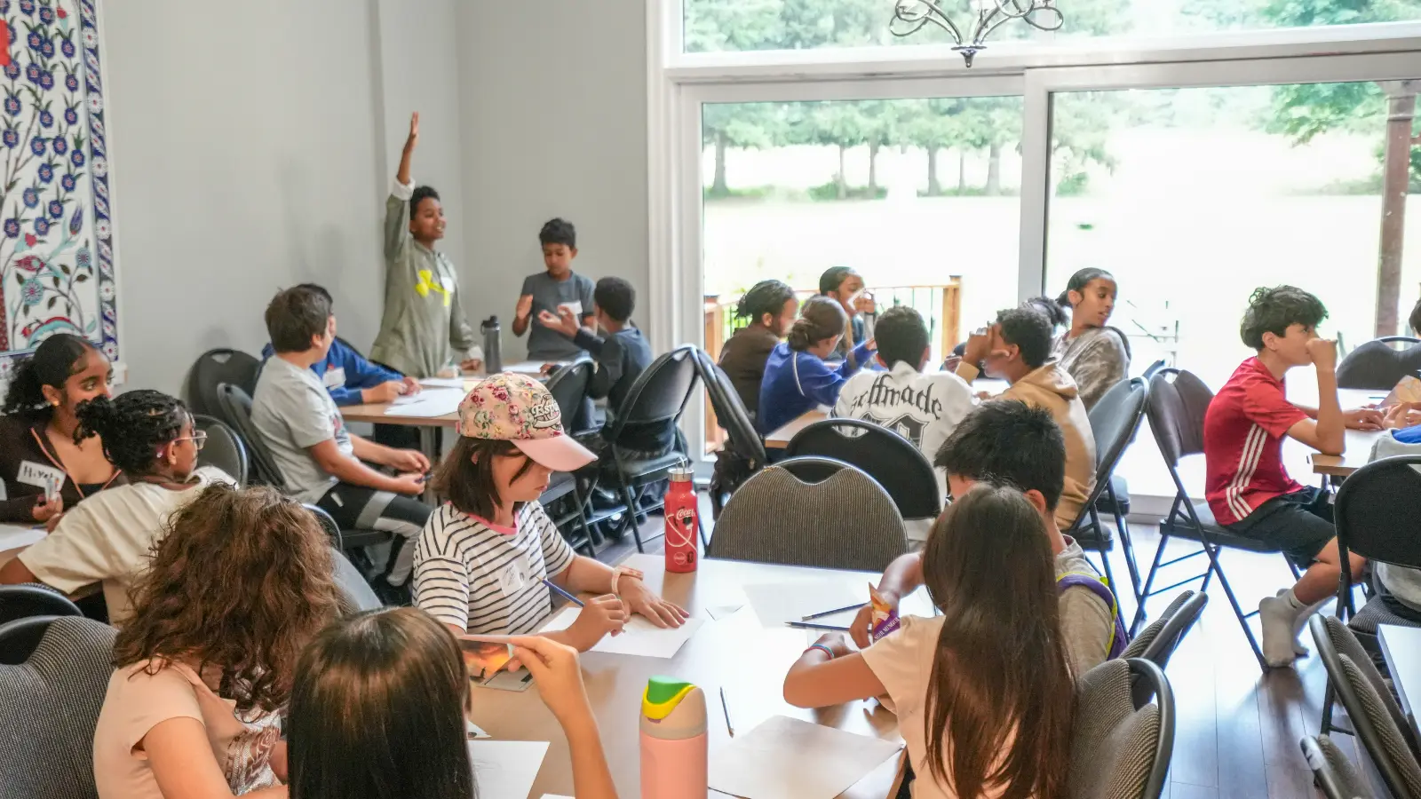 Children taking part in a drawing and guessing activity during GRFS Kids To Camp 2026.