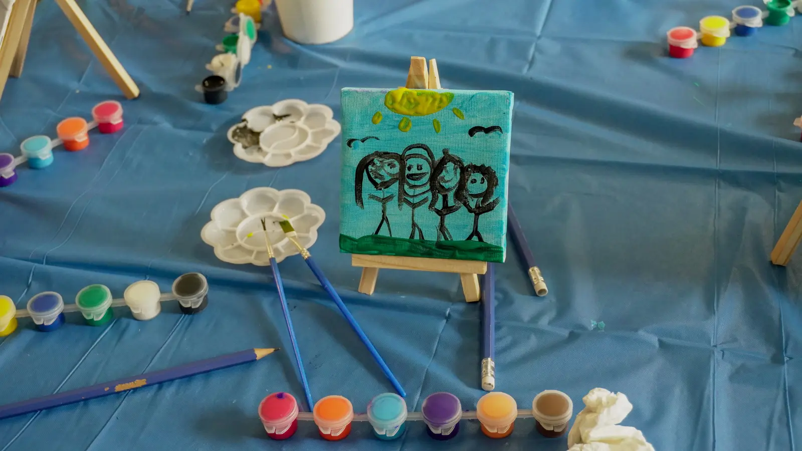A child’s painted mini canvas created during the Kids To Camp 2026 art workshop.