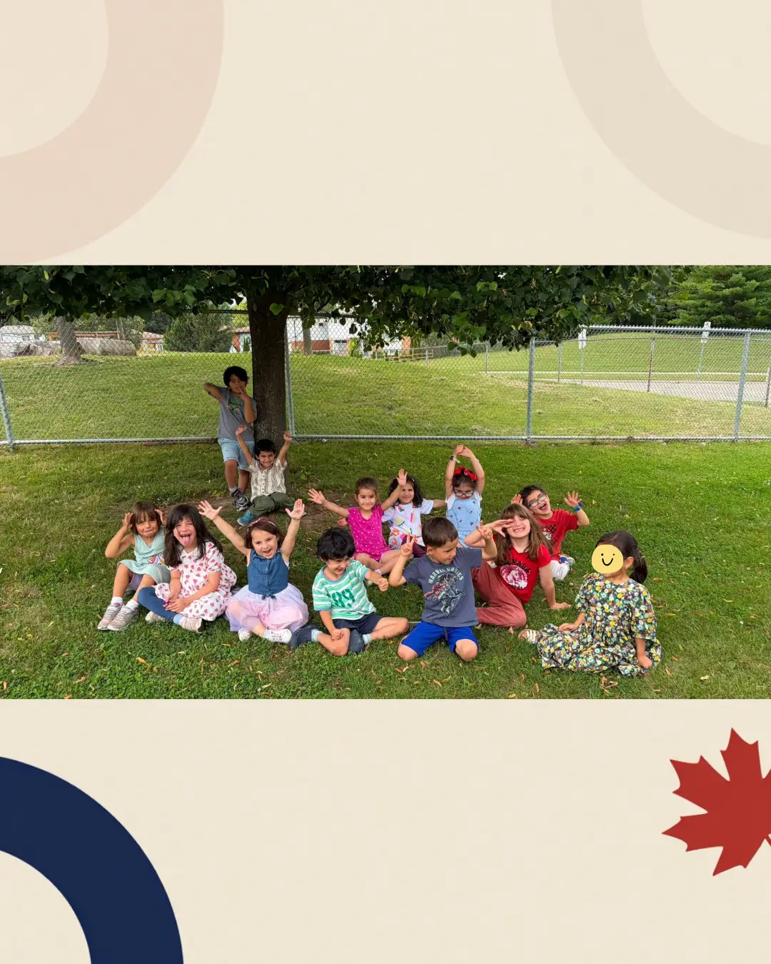Children gathering for a group photo on the grass at GRFS Summer School 2026