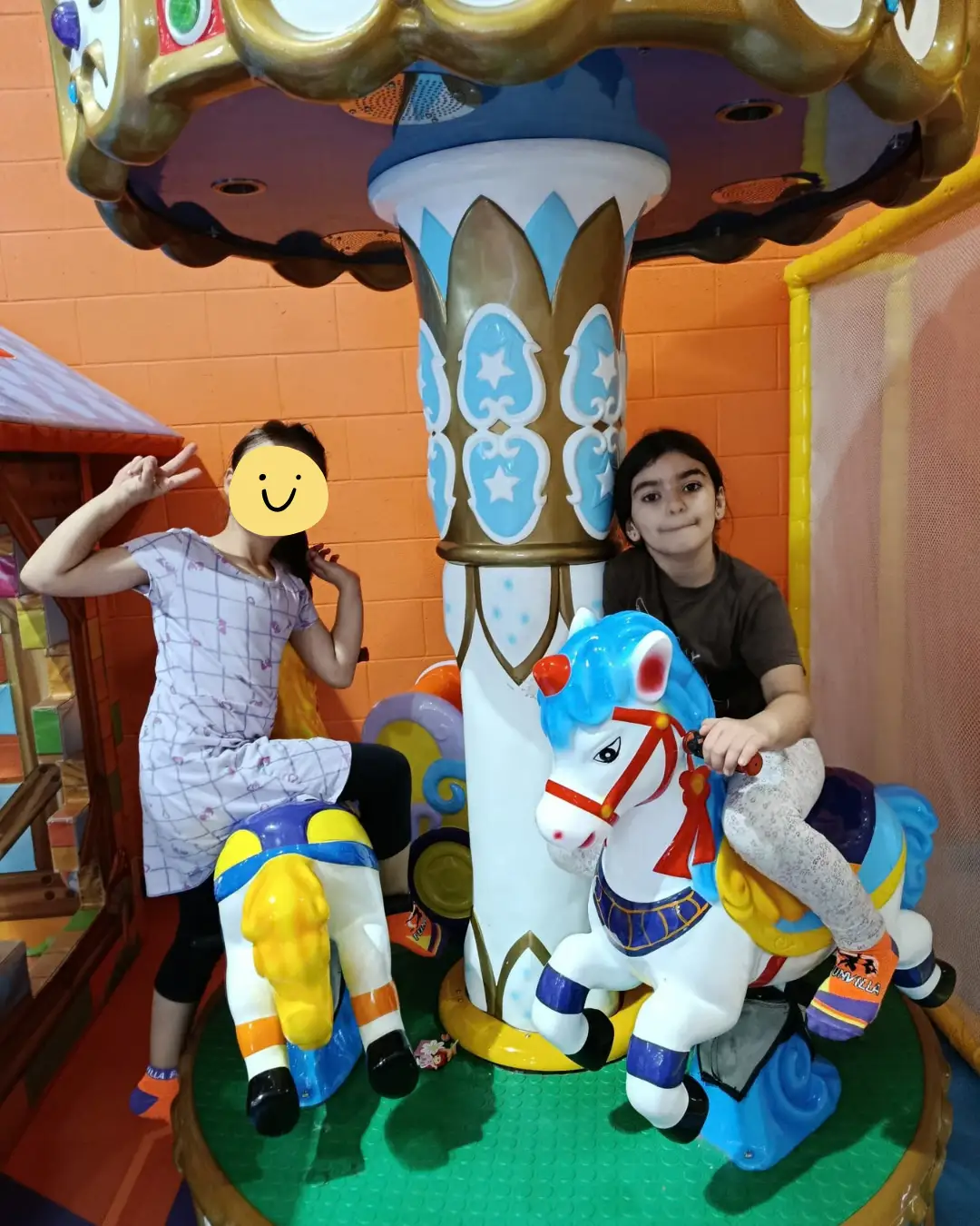 Children enjoying a carousel ride at an indoor play venue at GRFS Summer School 2026