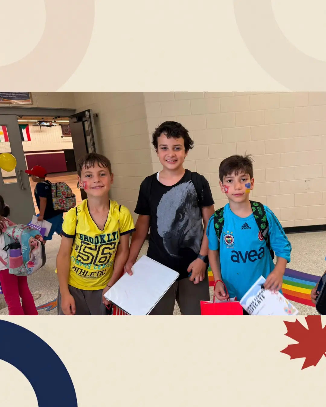 Three children with certificates and gift bags at the summer celebration at GRFS Summer School 2026